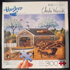 Charles Wysocki 300pc Puzzle "Dahlia Dinalhaven Makes a Dory Deal" EZ Grasp