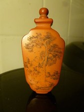 ANTIQUE CHINESE SNUFF BOTTLE  POSSIBLY CINNABAR OR AMBER WITH TREES AND MONK
