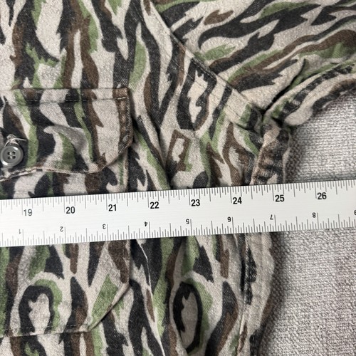Vintage woolrich men’s XL shirt with green and brown camouflage pattern, button front, and white measuring tape.