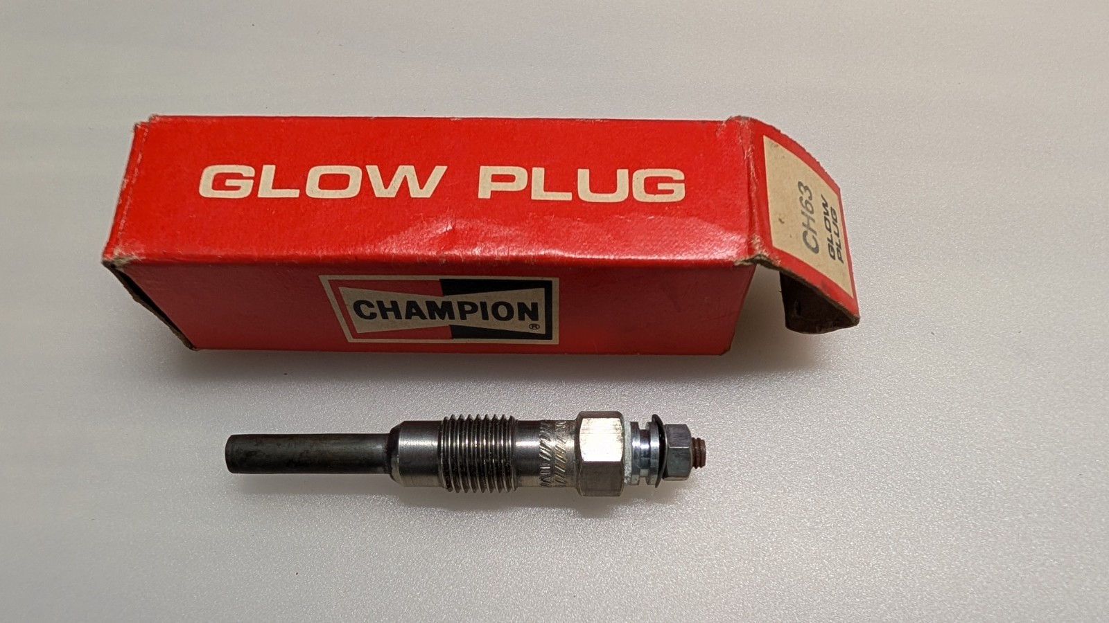One New NOS Champion Glow Plug. CH63 stk 163.