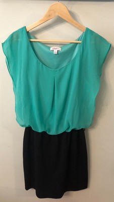 green top black skirt
