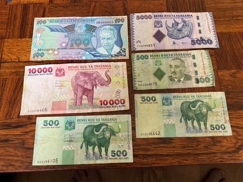 10,000, 5,000, 3 x 500 , 100 Tanzania shillings banknotes