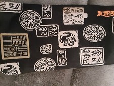 Mens black tie with Chinese print on it