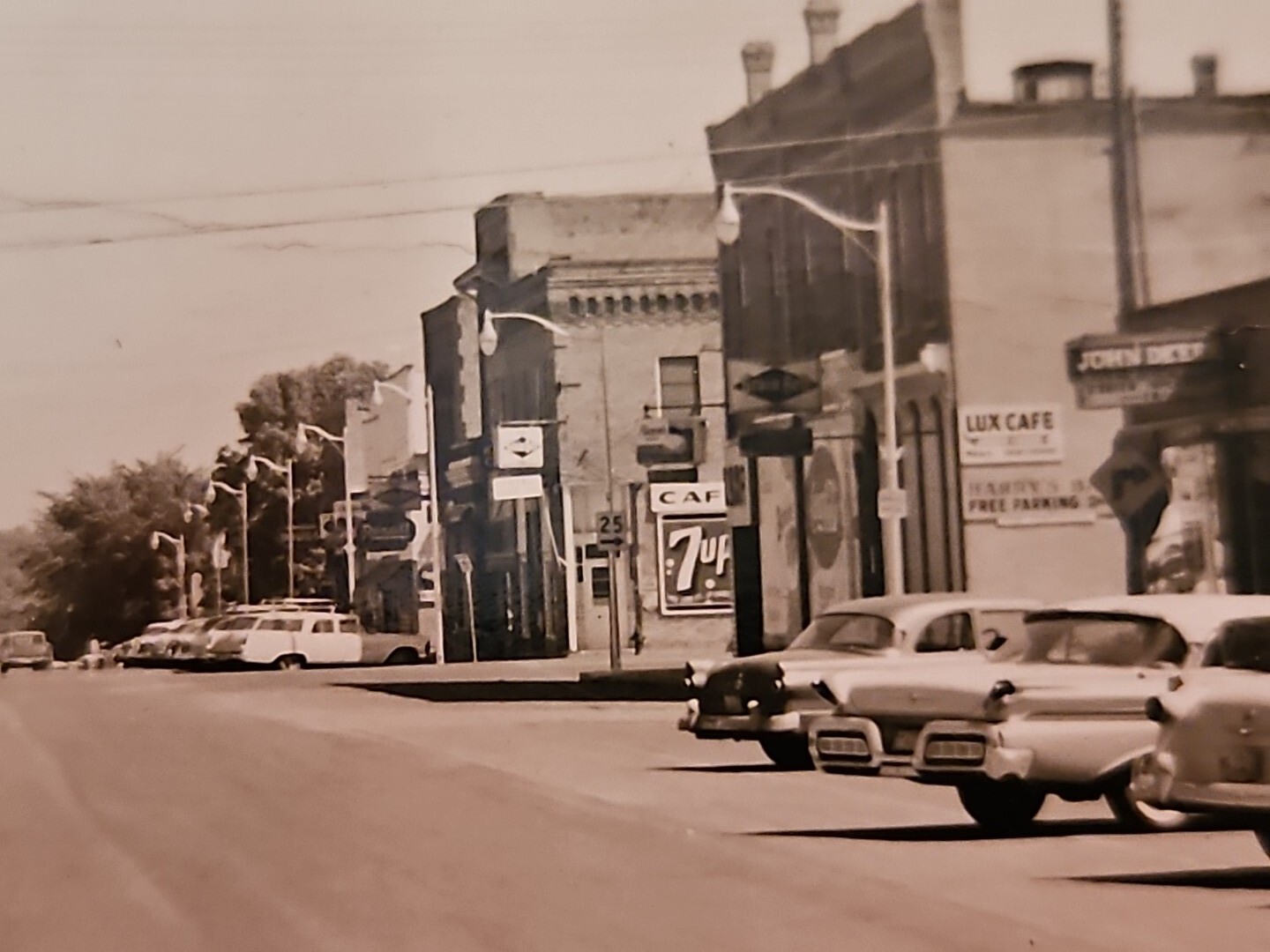 1950's Belle Plaine MN. RPPC Street Scene Ford Dealership John Deere