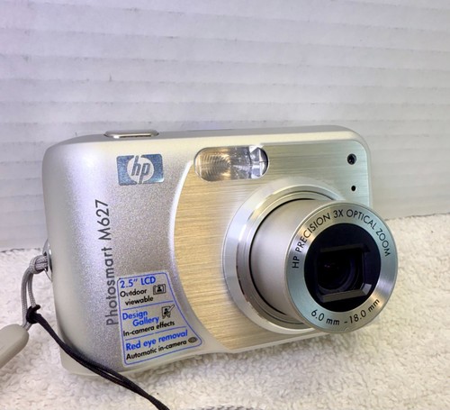HP Photosmart M627 7 megapixel fotocamera digitale con zoom ottico 3x - Foto 1 di 9