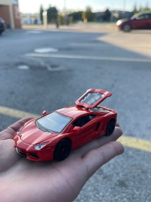 Red metal diecast Lamborghini car, opening doors, perfect for collectors