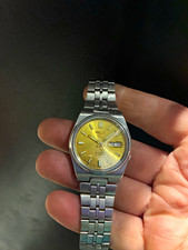 Seiko 5 7S26 Automatic 21J Gold Dial Day/Date Silver Stainless Bracelet