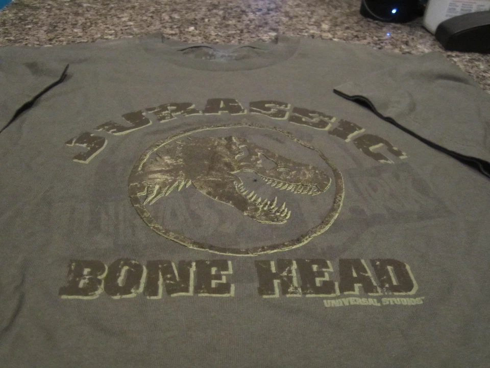Camiseta Jurassic World Juvenil - Verde - Juvenil XL - "Jurassic Bonehead" Foto 2 de 2
