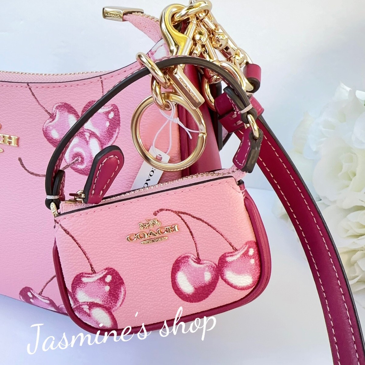 NWT Coach Mini Bag Charm In Signature With cherry Print NWT Coach Mini Bag Charm In Signature With cherry Print