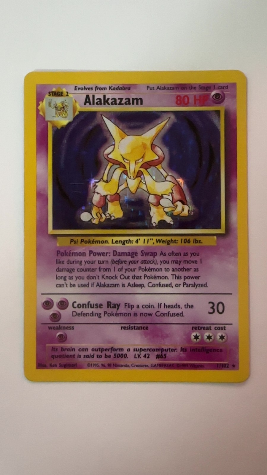 1999 Pokémon Base Set Alakazam Holo Rare #1/102 Unlimited