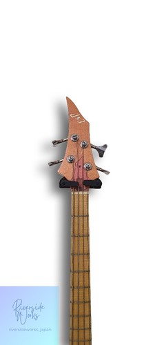 Long ESP Forest bass with gold hardware, red-brown fretboard, and “ESP” logo on headstock, viewed from above.