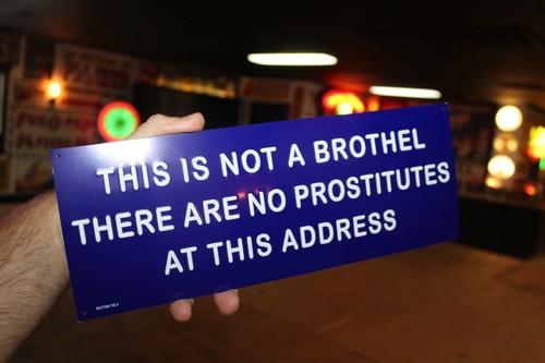 NOT A BROTHEL NO PROSTITUTES EMBOSSED METAL SIGN STRIP CLUB GAS OIL FUNNY HUMOR - Picture 2 of 7