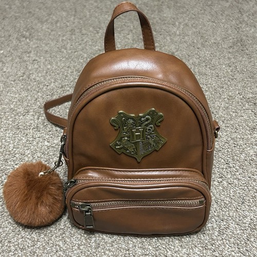 Universal Studios Harry Potter Hogwarts House Crest Mini Brown Backpack Pom Pom