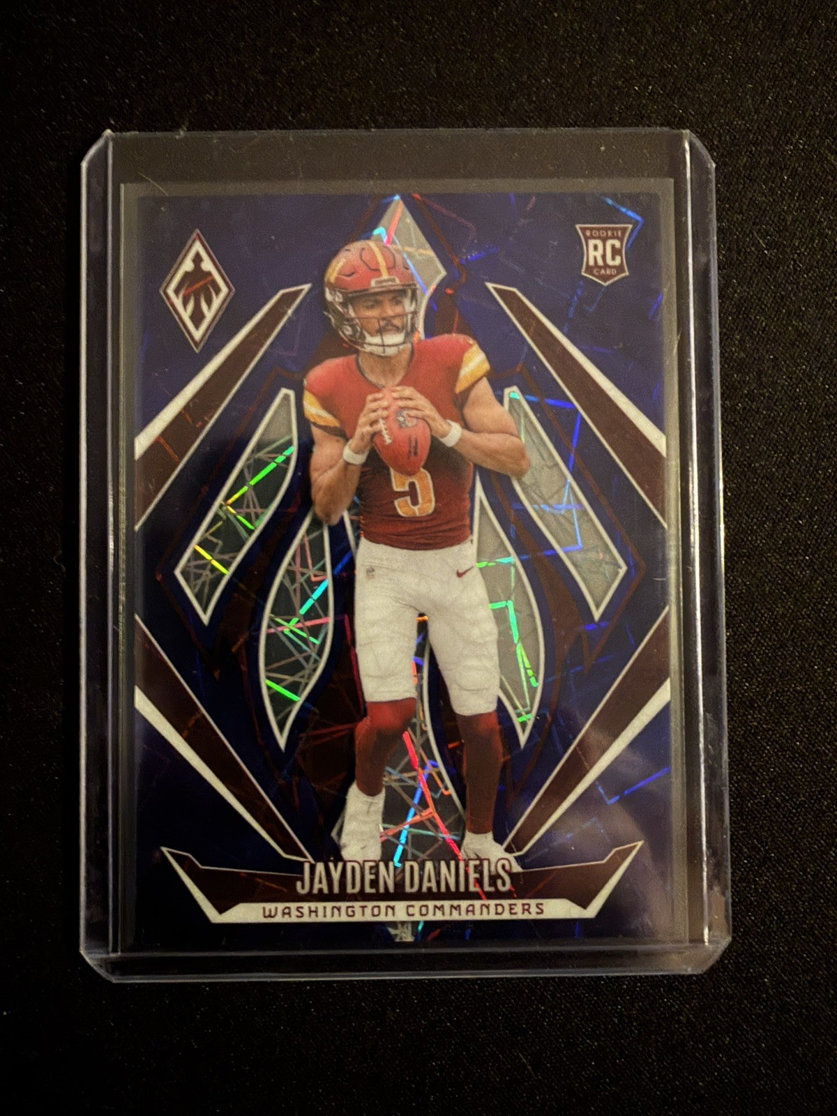 2024 Panini Phoenix - Rookies Jayden Daniels #198 Blue Lazer /125 (RC)