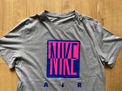gray and pink nike shirt