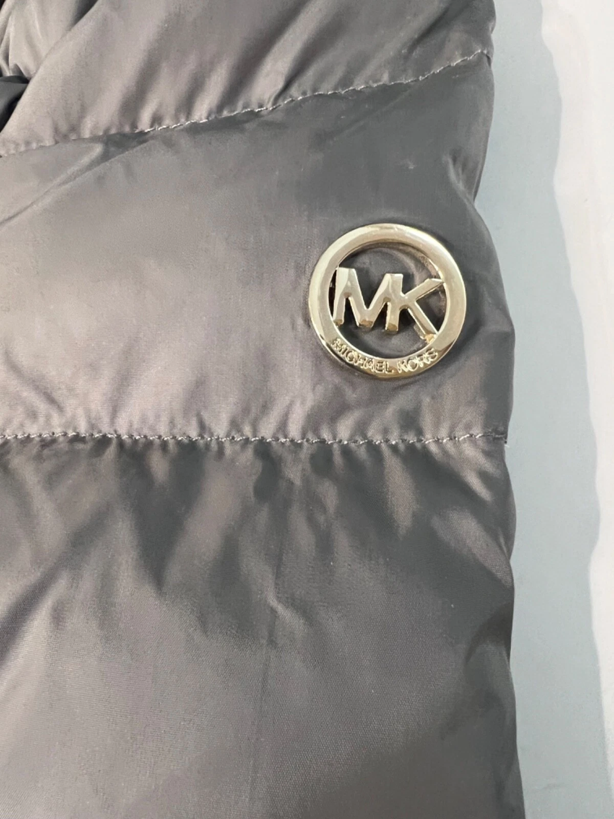 Giacca lunga Michael Kors Puffer nuova con cappuccio in pelliccia sintetica grigio taglia PXS