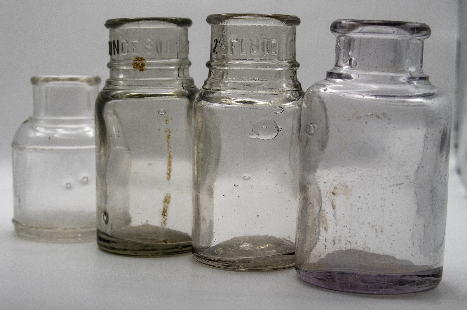 LOT OF (4) ANTIQUE INK WELL and MEDICINE BOTTLES PURPLE CLEAR BUBBLE GLASS