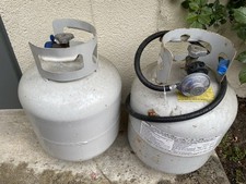 Two 20lbs Propane Tanks with OPD valves-one full, one 1/4 full