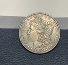 (#100661)  Morgan Dollar: 1887  unc+  Great reverse rainbow toning  (see video!)