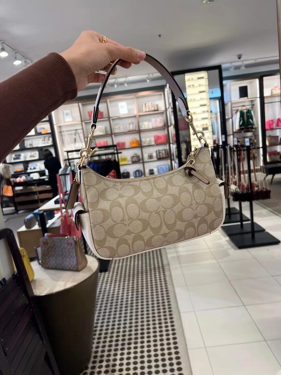 coach pennie shoulder bag in signature canvas