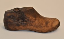 Antique baby shoe solid wood mold. App. 6 long, 2 wide.