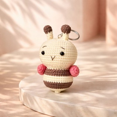 This handmade keychain is carefully crocheted from soft wool yarn and designed i
