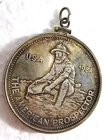 1984 ONE TROY OUNCE FINE/999 SILVER COIN, THE AMERICAN PROSPECTOR PENDANT MOUNT