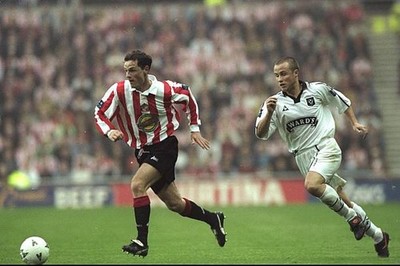 Allan Johnston of Sunderland gets away from Paul Devlin of Sheffie- Old Photo