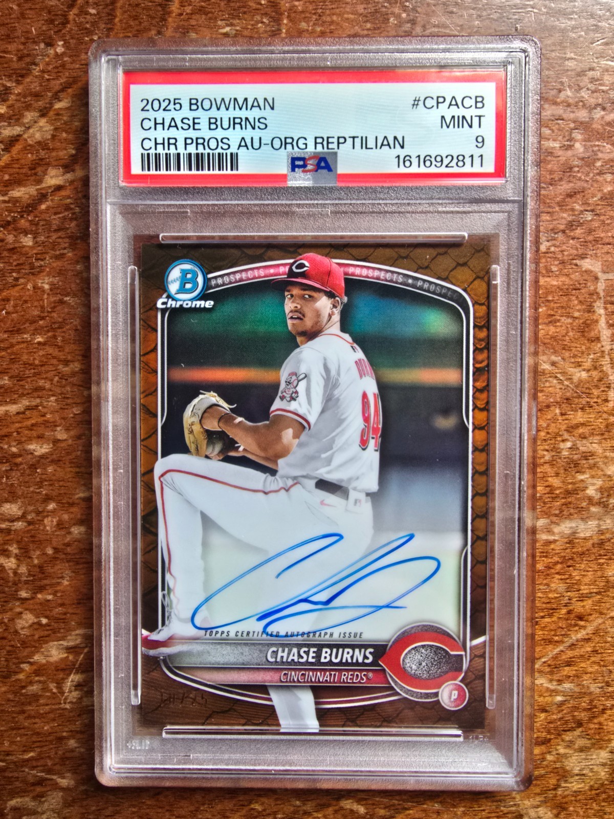 Chase Burns/ Auto/ PSA/ 2025/ Bowman Chrome Prospect/ Orange Reptilian/ 10 of 25