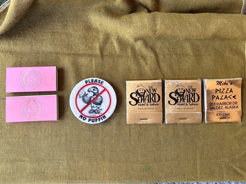 CLEVER SMOKING IRONY FROM ALASKA: 1 NICE “NO PUFFIN” MAGNET & 5 MATCHBOOKS/BOXES