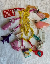Vintage Bell Charm Necklace 80s 11 Charms On Plastic Chain Unicorn Tennis Comb