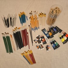 Art Supplies Large Lot 26 Tubes Of Acrylic Paint and 150 brushes.