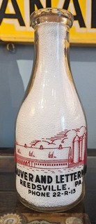 LAUVER and LETTERMAN REEDSVILLE PA PHONE 22 R 13 HOLSTEIN TWO COLOR MILK BOTTLE