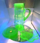 #873 lot seven Vaseline uranium depression glass 11' pitcher 5 saucer cany dish