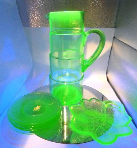 #873 lot seven Vaseline uranium depression glass 11' pitcher 5 saucer cany dish