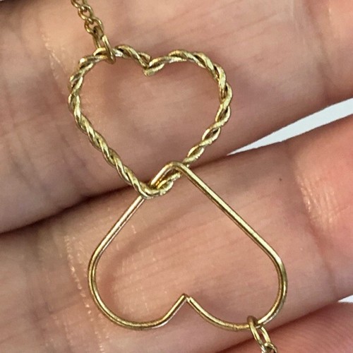 Collana con due cuori intrecciati intrecciati intrecciati tono oro galleggiante - Foto 4 di 8
