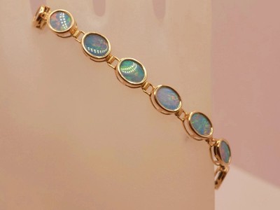 6 kt Ovalschliff Laborgefertigter Feueropal Damen Tennis Armband 14 K Gelbgold vergoldet
