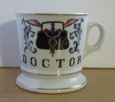 DOCTOR  coffee cup with gold trim and doctor logo on front