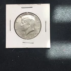 A 1966 Kennedy Half In AU+ Condition.