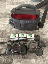 Canon AE-1 w/ FD 50mm and FD 35-70mm Lenses. Also 3 Rolls 35mm Film