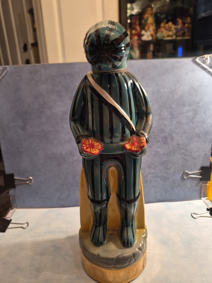 A hand-crafted Ezra Brooks ceramic Kachina decanter shaped like a rattlesnake-and-watermelon figure — wildly sculptural and deeply collectible Americana.