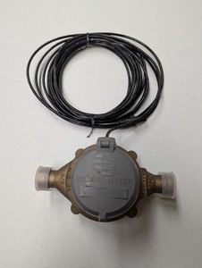 Used Badger model 25 5/8" brass water meter with HR E lcd register