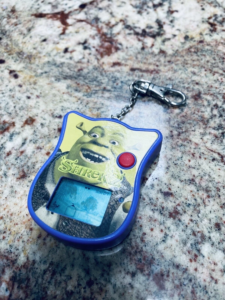 SHREK 2 2004 Electrónico Portátil LCD Llavero Videojuego Techno Fuente Bl Foto 2 de 4