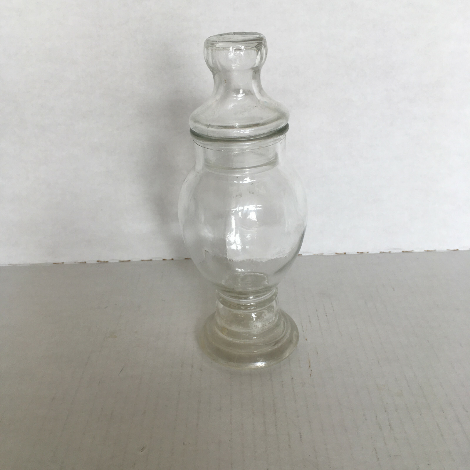 Vintage apothecary style tall glass jar with glass lid vanity bathroom