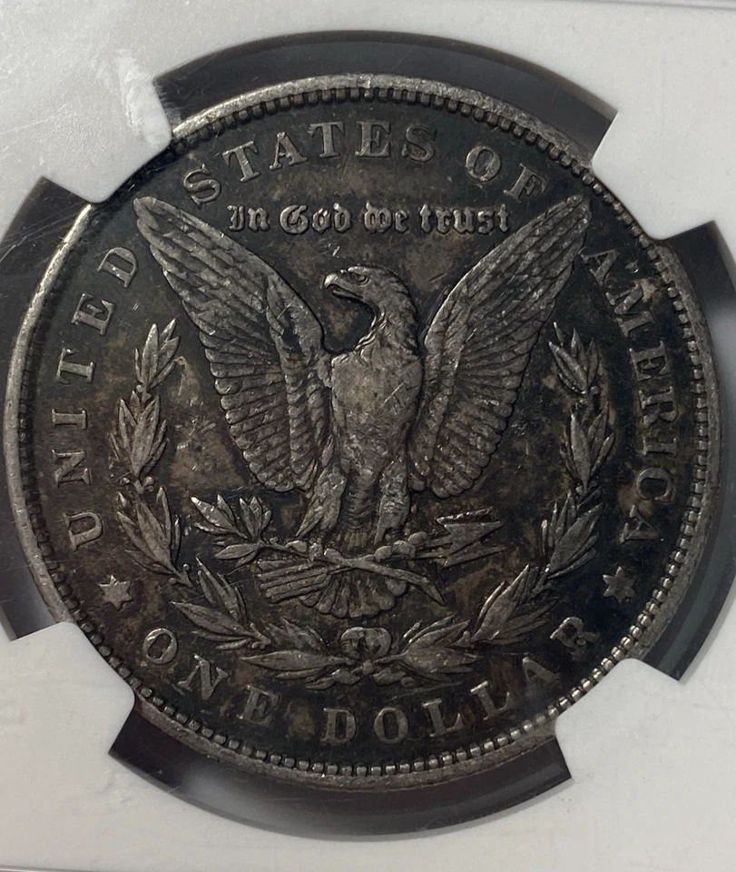 1878 7TF REV OF 79 $1 Morgan Silver Dollar. 90% Silver. NGC Genuine KM#110 - Image 4 of 4