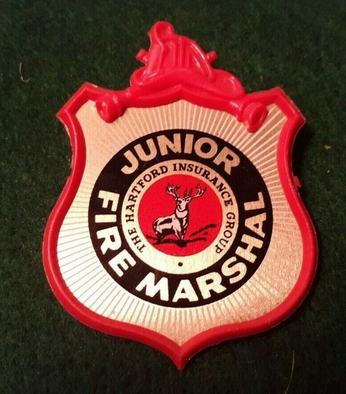 1965 Stoffel Lapel Emblem JUNIOR FIRE MARSHALL Toy Badge w HARTFORD Insurance