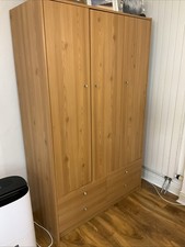 Pine Three-Door Wardrobe with Four Drawers And Four Shelves