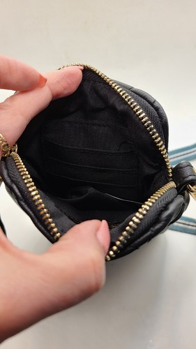 Purse by Sandra Roberts black quilted crossbody. Faux leather. 2 outer zippers. - Picture 5 of 7