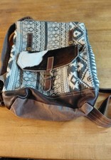 Myra Backpack. Geometric Design. Cowhide Assents. Adjustable Straps.