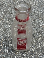 VTG Norwood's Dairy clear glass milk bottle from Milford, New Hampshire, Red